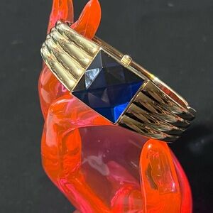 Gruen Gold Tone w/ Blue Gem-Style Cover Hidden Dial Cuff Bracelet Quartz Watch